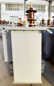 Фото трансформатора ТМГ 40 в профиль на складе